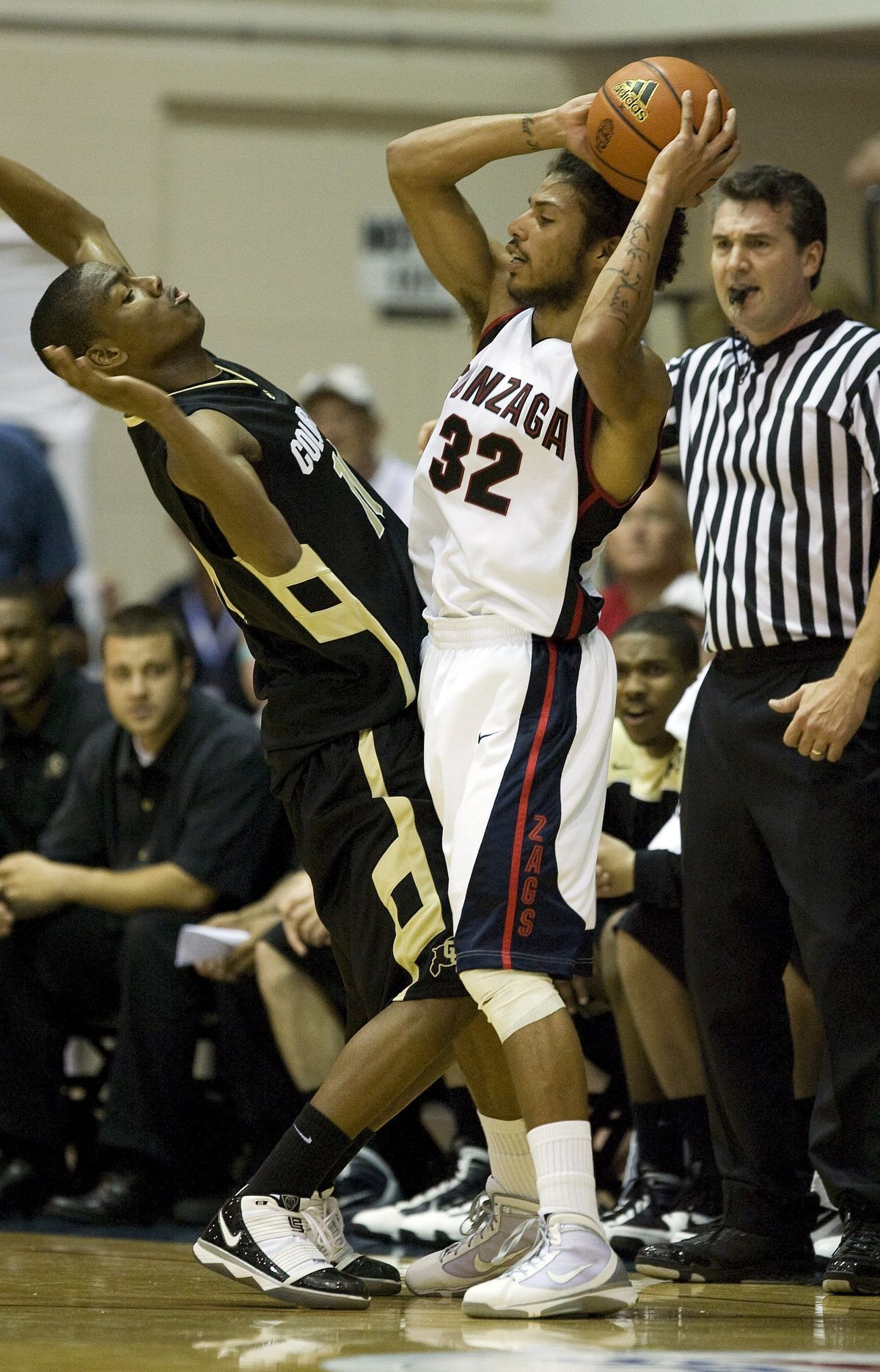 Colorado guard Cory Higgins (11) leans back to avoid Gonzaga guard Steven Gray (32) in the first half during their game in the Maui Invitational NCAA college basketball tournament at the Lahaina Civic Center in Lahaina, Hawaii on Monday Nov. 23, 2009. (Eugene Tanner / Fr168001 Ap)