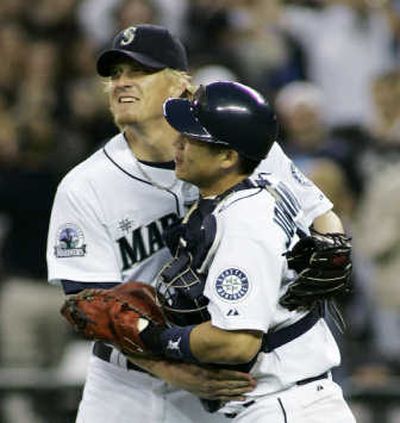 
There were a lot of hugs for Jeff Weaver, left, starting with catcher Kenji Johjima.Associated Press
 (Associated Press / The Spokesman-Review)
