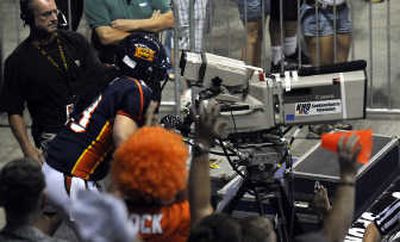
Shock's Lee Foliaki celebrates his touchdown reception by taking over for the end-zone cameraman. 
 (Dan Pelle / The Spokesman-Review)