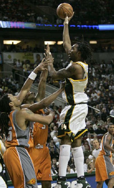 
Chris Wilcox, right, has been averaging 15 points since coming to Seattle.
 (Associated Press / The Spokesman-Review)