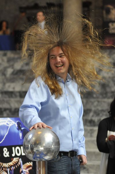 OLYMPIA -- Peter DeFranco of Seattle checks out an exhibit on electricity from the Pacific Science Center set up  in the Capitol Rotunda. (Jim Camden)