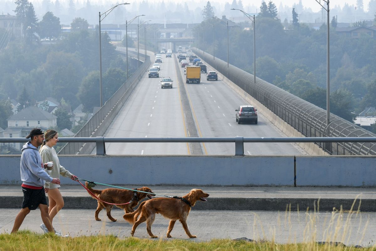 Wildfire smoke engulfs Spokane and the Maple Street Bridge on Monday.  (DAN PELLE/THE SPOKESMAN-REVIEW)