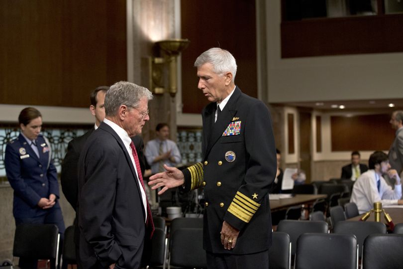 Sen. James Inhofe, R-Okla., left, confers with Adm. Samuel Locklear, commander of U.S. Pacific Command, on Capitol Hill in Washington on Tuesday. (Associated Press)