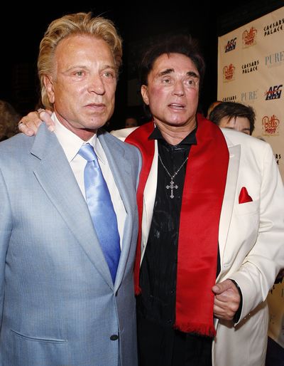 Siegfried Fischbacher, left,  and Roy Horn, seen here in  February 2008,  performed Saturday in Las Vegas with the tiger that ended their careers. (File Associated Press / The Spokesman-Review)