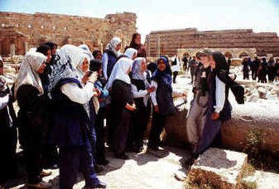 Libyan school girls on a trip take photographs of themselves with Western tourists.
(Los Angeles Times / The Spokesman-Review)