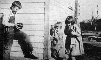 
From left, Hiram Shouse Jr., plays with his brother, Henry, and sister, Eileen, in 1925.Historic photos courtesy of Eileen S. Wise
 (Historic photos courtesy of Eileen S. Wise / The Spokesman-Review)