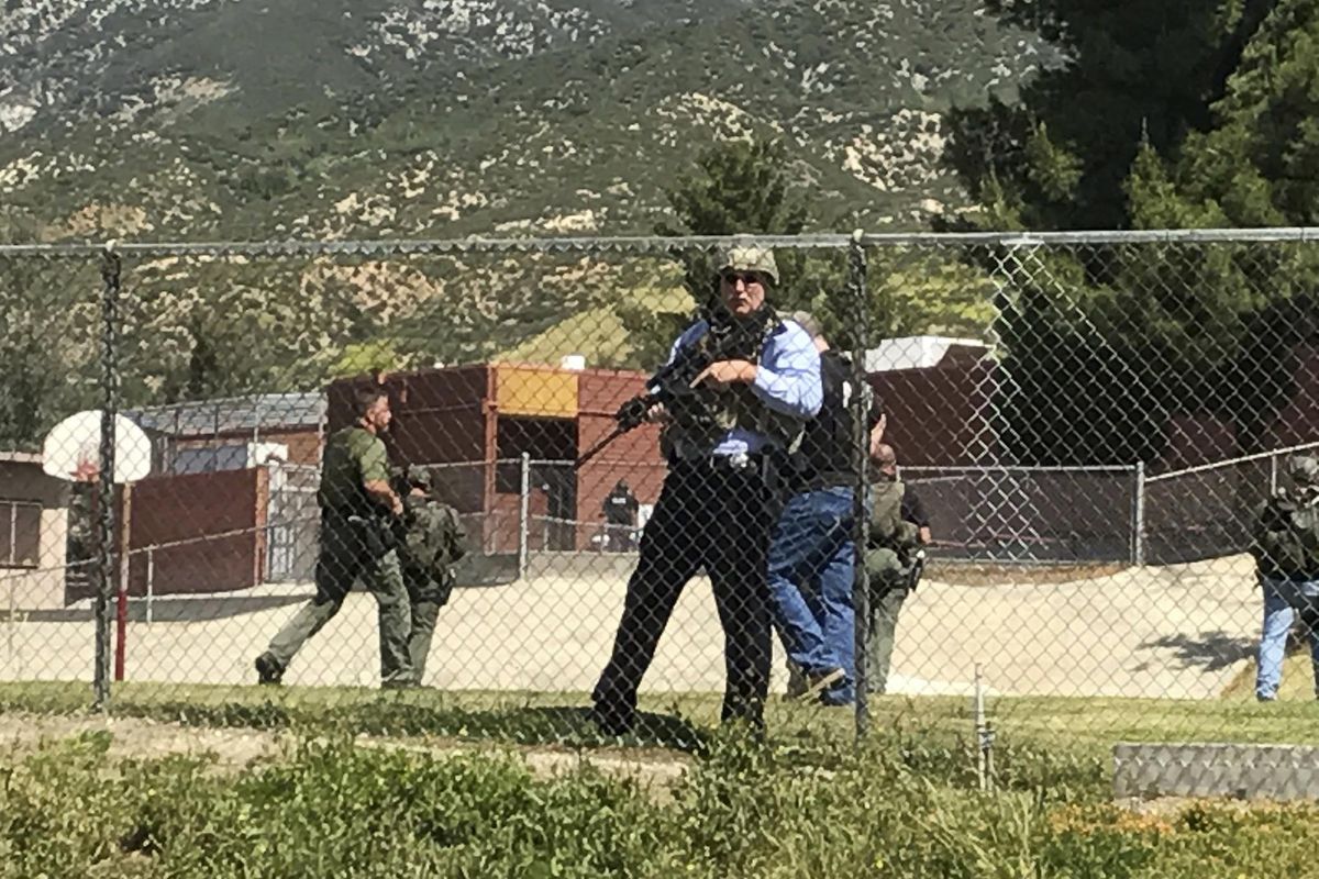 Emergency personnel respond to a shooting inside North Park School Elementary School on Monday, April 10, 2017, in San Bernardino, Calif. (Rick Sforza / Los Angeles Daily News via AP)