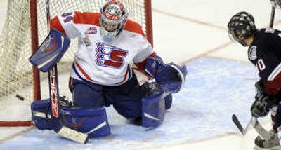 
Dustin Tokarski deflects a shot, but didn't face any in first period. 
 (Jesse Tinsley / The Spokesman-Review)