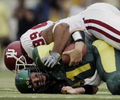 
Oregon felt altogether buried in the first half at Autzen Stadium, including a second-quarter sack when Indiana's Robby Valenzuela bagged Kellen Clemens. 
 (Associated Press / The Spokesman-Review)