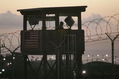 In this 2006 photo reviewed by the U.S. military, a U.S. soldier keeps watch at Camp Delta detention center on Guantanamo Bay U.S. Naval Base in Cuba.  (Associated Press / The Spokesman-Review)