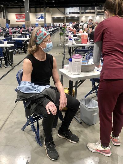 Receiving the first shot of the Pfizer vaccine at Lumen Field in Seattle. (Leslie Kelly)