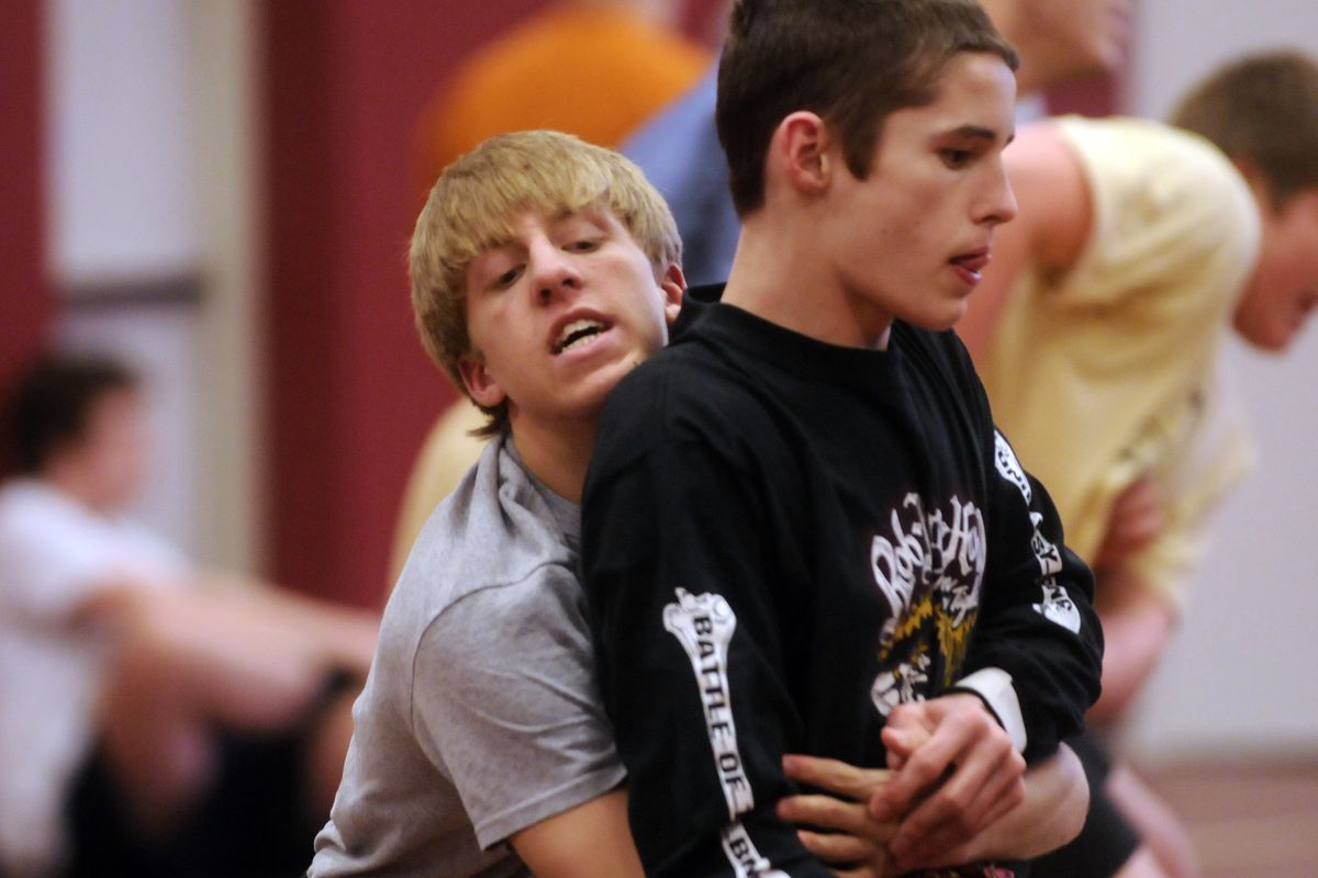 U-Hi senior 119-pounder Brandon Matlock spars with  125-pound sophomore Ryan Gabel. 