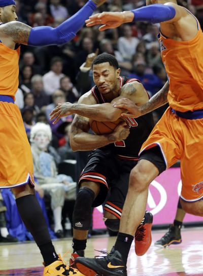 Chicago Bulls guard Derrick Rose drives to the basket Thursday night against the New York Knicks. (Associated Press)