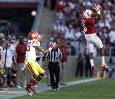 Stanford cornerback Terrence Brown intercepts a pass intended for USC wide receiver Nelson Agholor. (Associated Press)