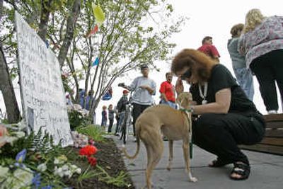 
Heather Harden prays during a memorial at Gold Medal Park for victims and families of the Interstate 35W bridge collapse Sunday in Minneapolis. Associated Press
 (Associated Press / The Spokesman-Review)