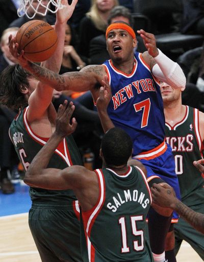 New Knick Carmelo Anthony drives past Milwaukee’s defense. (Associated Press)