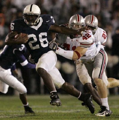 
Penn State running back Tony Hunt pushes away from Ohio State linebacker Bobby Carpenter during the first quarter of Saturday's Big Ten Conference game at State College, Pa., that Hunt's Nittany Lions won 17-10. 
 (Associated Press / The Spokesman-Review)