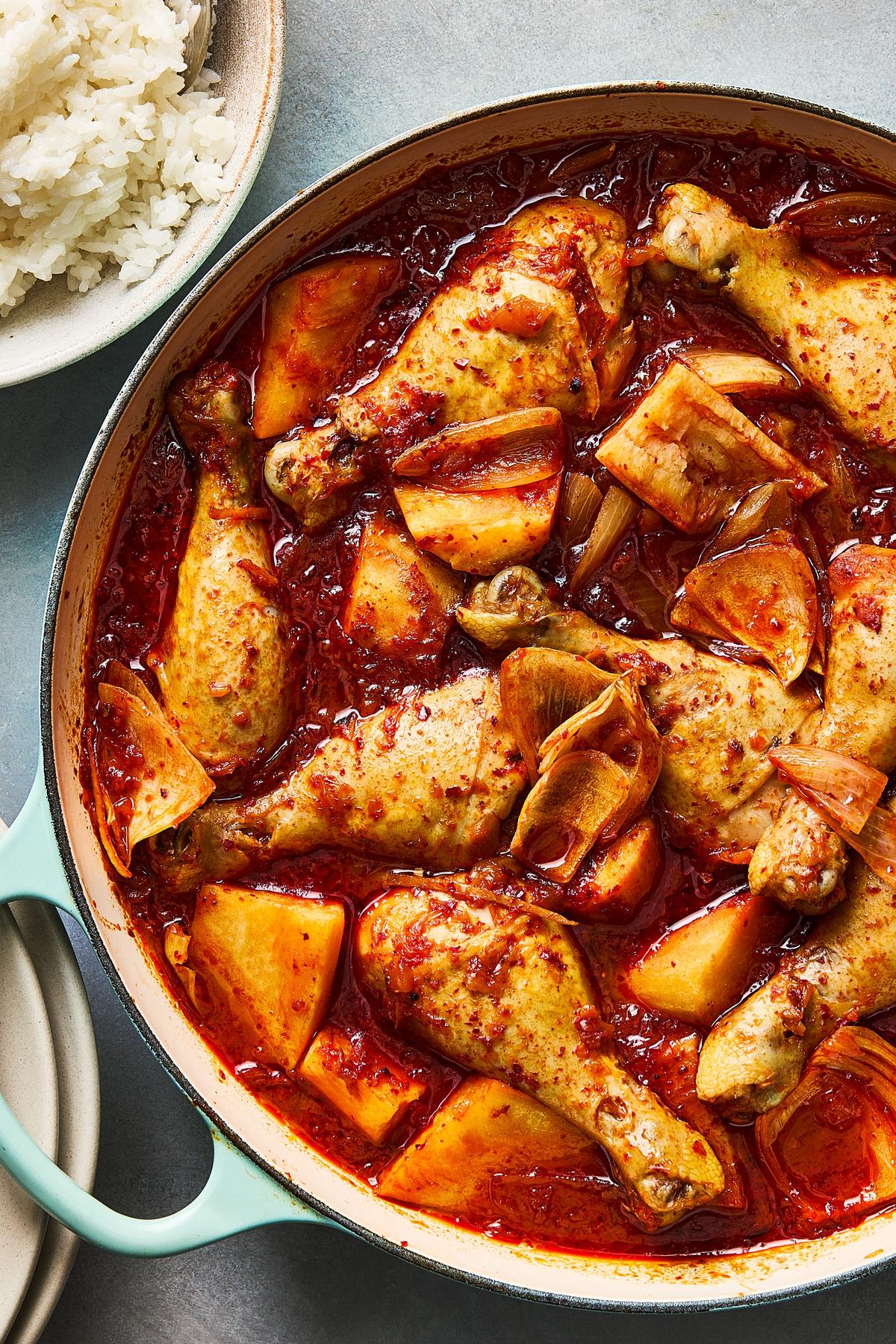 Braised kimchi chicken with sweet potatoes. Water, not stock, serves as the liquid in this braise, which becomes infused with flavor from the chicken and kimchi. (New York Times)