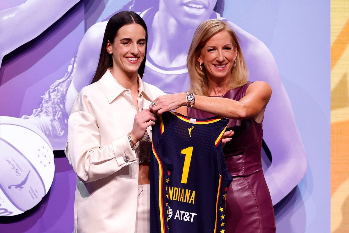 Caitlin Clark poses with WNBA Commissioner Cathy Engelbert after being selected as the first overall pick by the Indiana Fever during the WNBA draft at Brooklyn Academy of Music on April 15 in New York City.  (Tribune News Service)