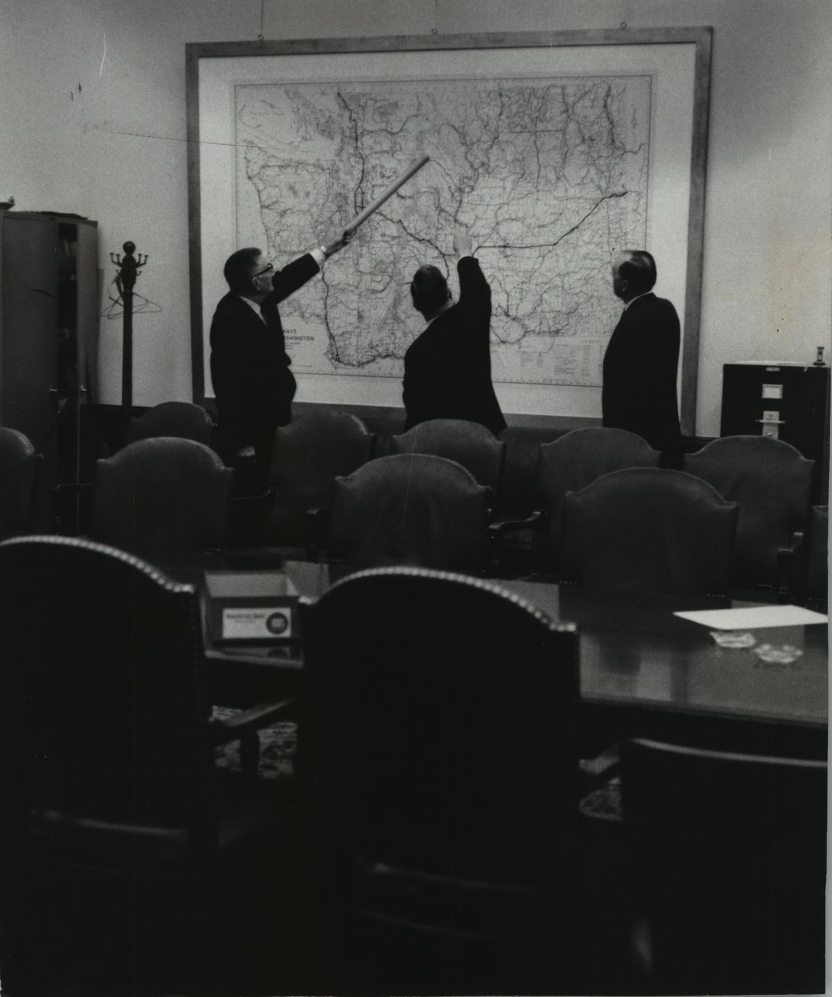 Three eastern Washington representatives, from left, Joseph Haussler, Horace Bozarth and Elmer Huntley, in Highway Committee Hearing Room of House in 1965. (Spokesman-Review archives)