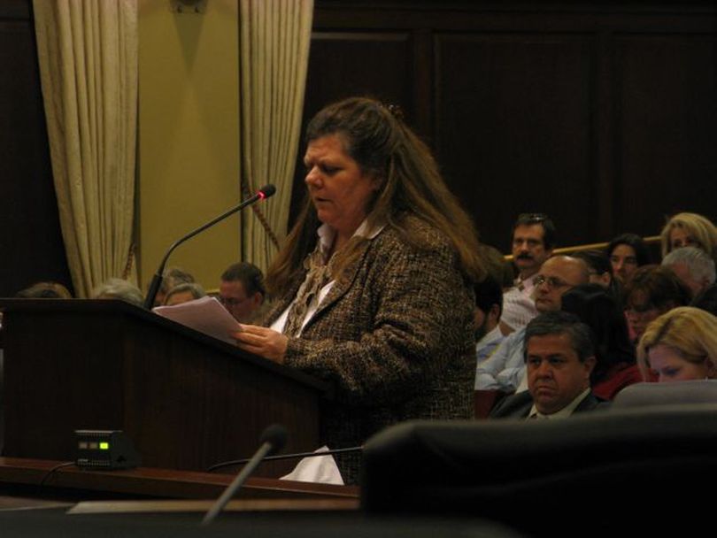 Lorna Finman of Post Falls testifies Tuesday in favor of the Luna school reform plan; she called laptop computers 