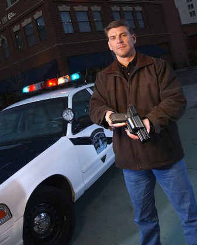 
Mike Lowe designed a new holster that helps keep police safe. 
 (Matt Cille photo / The Spokesman-Review)