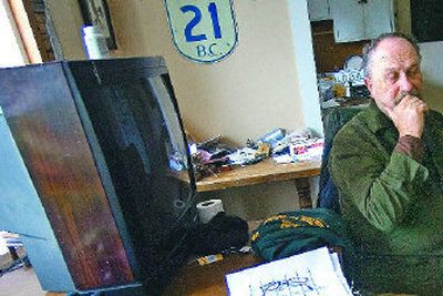 
William Walker sits in his house Wednesday expressing his concerns about a beating that has left a boarder hospitalized in critical condition. 
 (Christopher Anderson / The Spokesman-Review)