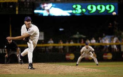 Randy Johnson becomes the 12th pitcher this century to strike out