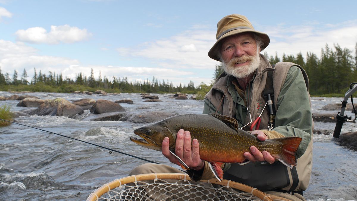 Author John Gierach holds the subject of his quest for Canadian brook trout in “North of the Wild,” a film featured in the 2014 Fly Fishing Film Tour.