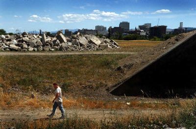 
A man walks through a portion  of the proposed Kendall Yards development Monday that could someday be a neighborhood of  at least 2,600 residences. 
 (Brian Plonka / The Spokesman-Review)