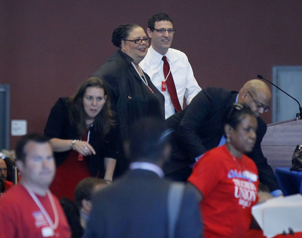 Karen Lewis, president of the Chicago teachers union , left, and vice president Jesse Sharkey stand before a meeting of the union