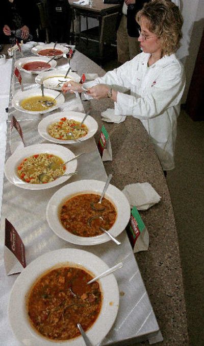 
Kristy Smith with research and development for Campbell Soup Co. samples some of the company's new reduced sodium soups during an in-house tasting last week. 
 (Associated Press / The Spokesman-Review)