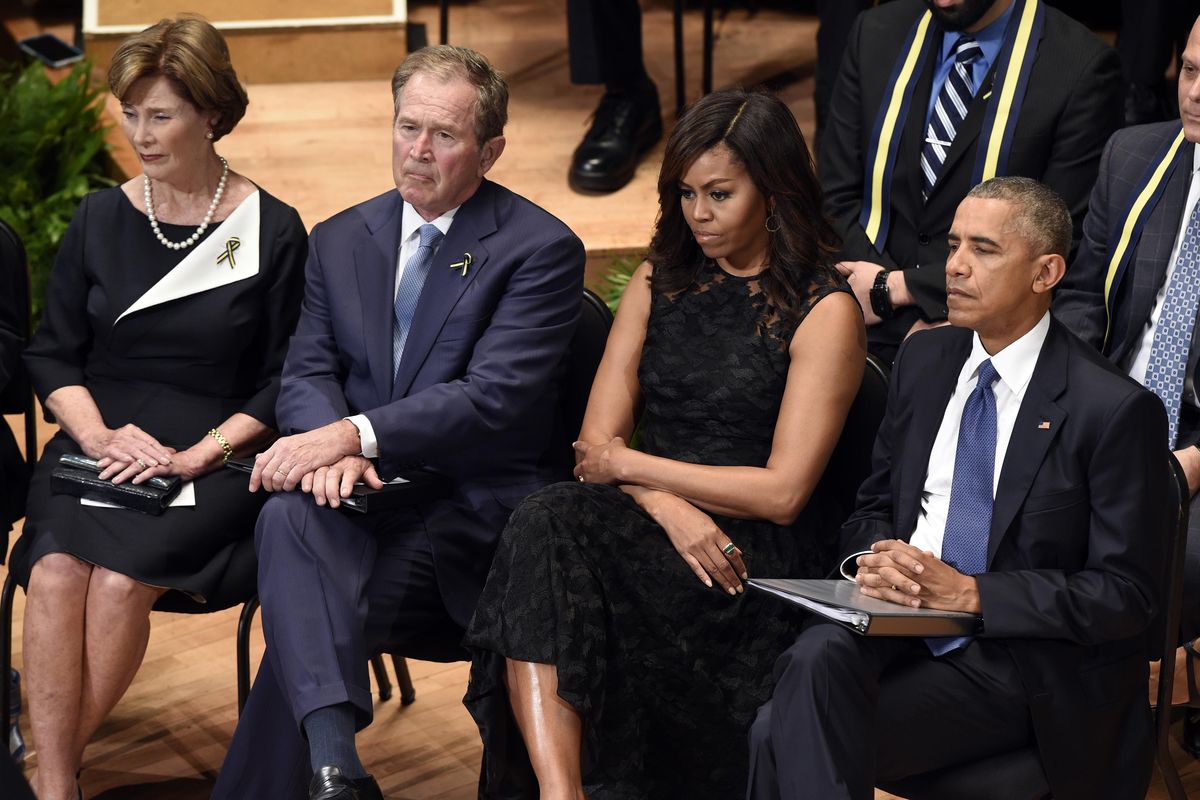Former first lady Laura Bush, former President George W. Bush, first lady Michelle Obama, and President Barack Obama attend an interfaith memorial service for the fallen police officers in Dallas, Tuesday. (Susan Walsh / Associated Press)