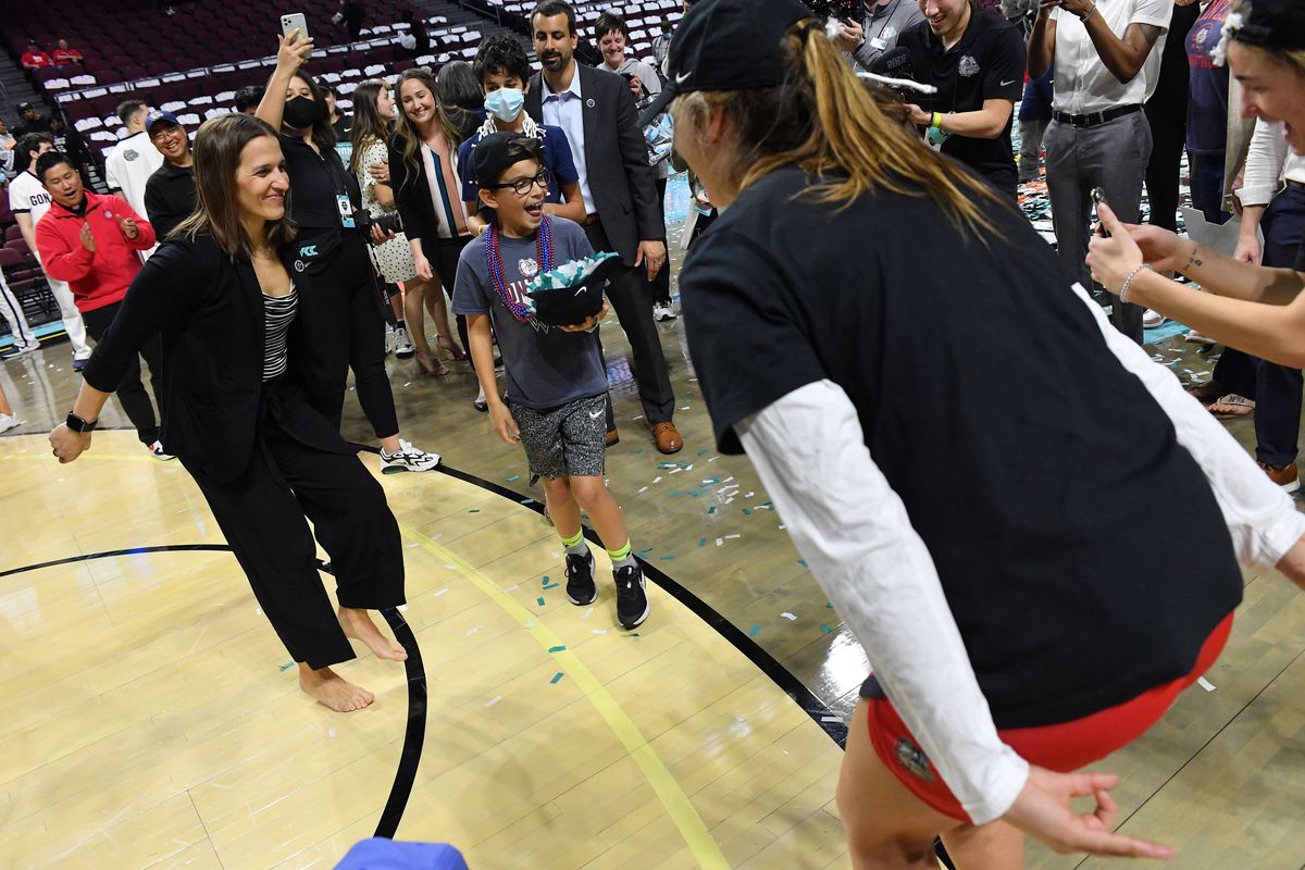 Gonzaga head coach Lisa Fortier dances with players Tuesday after the Bulldogs defeated the BYU Cougars 71-59 in the West Coast Conference Tournament championship at the Orleans in Las Vegas.  (Tyler Tjomsland/The Spokesman-Review)