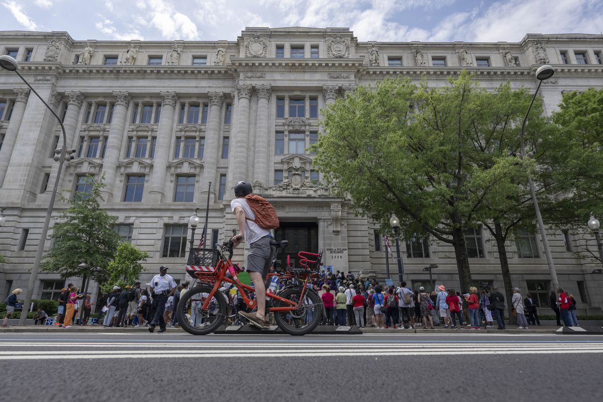 Demonstrators protesting changes at the Smithsonian gather on the steps of the John Wilson building in D.C. last May.  (Craig Hudson/For the Washington Post)