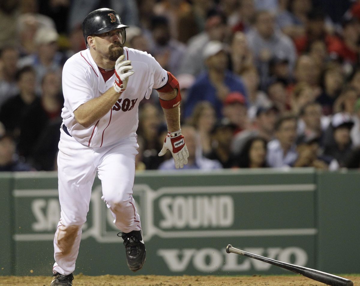 Boston’s Kevin Youkilis heads to first base after hitting a two-run triple in the sixth inning, one of his three extra-base hits. (Associated Press)
