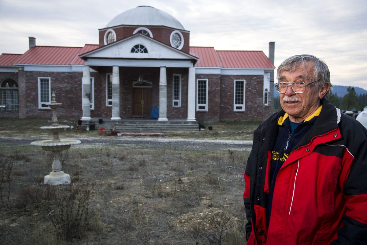Dan Sisson, a historian and EWU professor, stands in front of his home, which he has been building for 12 years, to look like Thomas Jefferson’s Monticello. (Colin Mulvany)