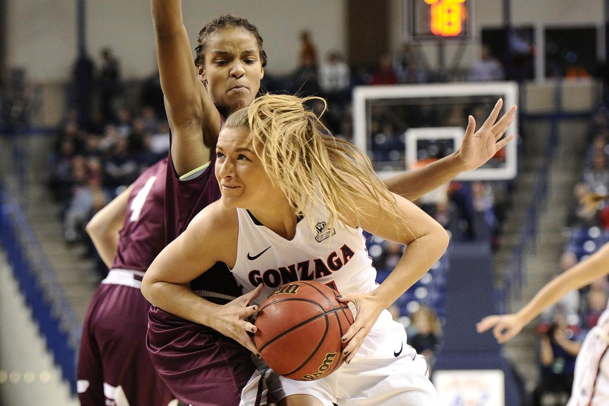 Gonzaga Bulldogs guard Laura Stockton (11) goes up for a basket against Colgate Raiders forward Mylah Chandler (0) during the first at the McCarthey Athletic Center. (James Snook / Special to The Spokesman-Review)
