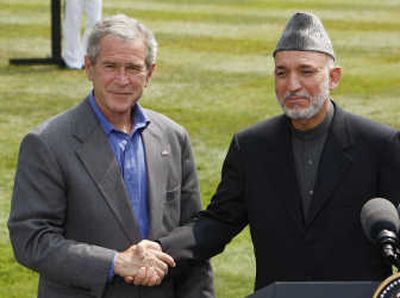 
President Bush and Afghanistan President Hamid Karzai concluded their talks Monday at Camp David. The two leaders disagreed on whether Iranian influence in Afghanistan is a 