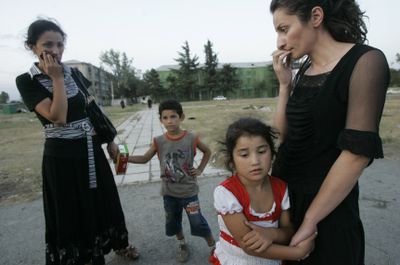Displaced people who fled fighting return to Tskhinvali, the main city of Georgia’s breakaway province of South Ossetia, Saturday.  (Associated Press / The Spokesman-Review)