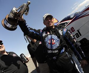 Robert Hight shows off his SummitRacing.com NHRA National event winning trophy. (Photo courtesy of NHRA)