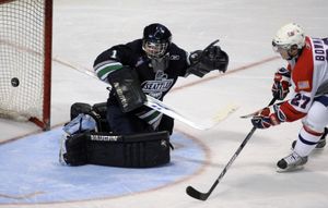 Drayson Bowman scores the first of his two goals against Seattle’s Calvin Pickard, tying the score at 1 in the second period of Friday’s playoff opener at the Arena.  (Colin Mulvany / The Spokesman-Review)