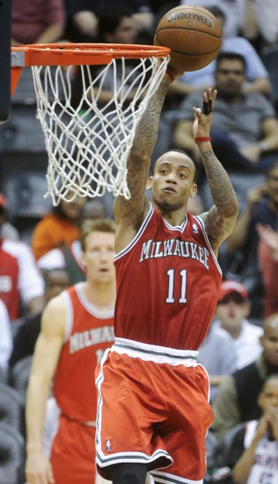 Milwaukee point guard Monta Ellis had 27 points, 17 assists in loss at Atlanta. (Associated Press)