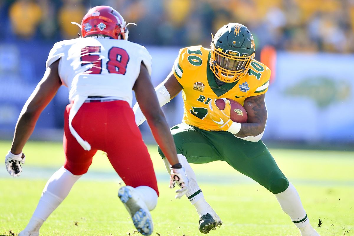North Dakota State Bison running back Lance Dunn (10) runs the ball against Eastern Washington Eagles linebacker Chris Ojoh (58) during the first half of the 2018 FCS Championship game on Saturday, January 5, 2019, at Toyota Stadium in Frisco, TX. (Tyler Tjomsland / The Spokesman-Review)