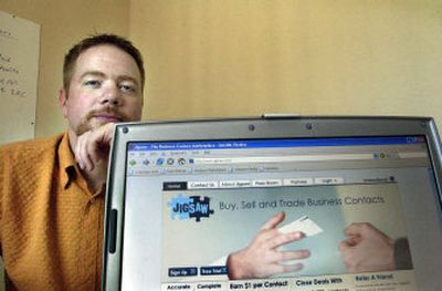 
Bob Memmer of Jigsaw Data Corp. at his Post Falls office on Monday. The company buys and sells business contacts for its online service. 
 (Brian Plonka / The Spokesman-Review)