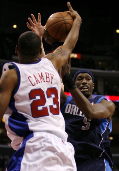 The Clippers’ Marcus Camby (23) blocks a shot by Dallas’ Josh Howard, right, during the first half at Los Angeles on Sunday.  (Associated Press / The Spokesman-Review)