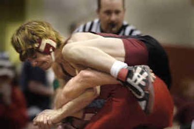 
University's Chase Fish gets the upper hand (and leg) on Eastmont's Joel Robbins in a 112-pound match on Saturday. 
 (Christopher Anderson/ / The Spokesman-Review)
