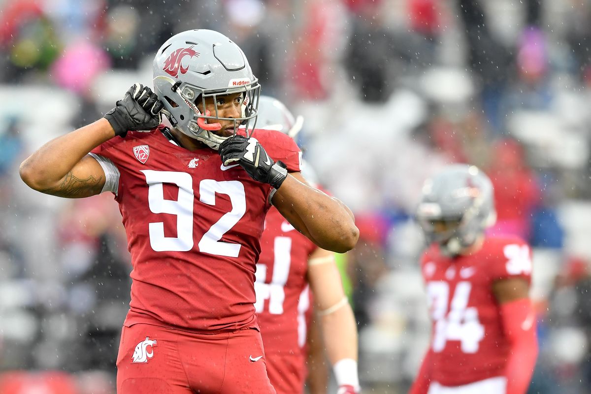 Washington State defensive end Will Rodgers III  adjusts his helmet between plays during the Cougars’ Crimson and Gray Game on Saturday at Martin Stadium in Pullman. (Tyler Tjomsland / The Spokesman-Review)