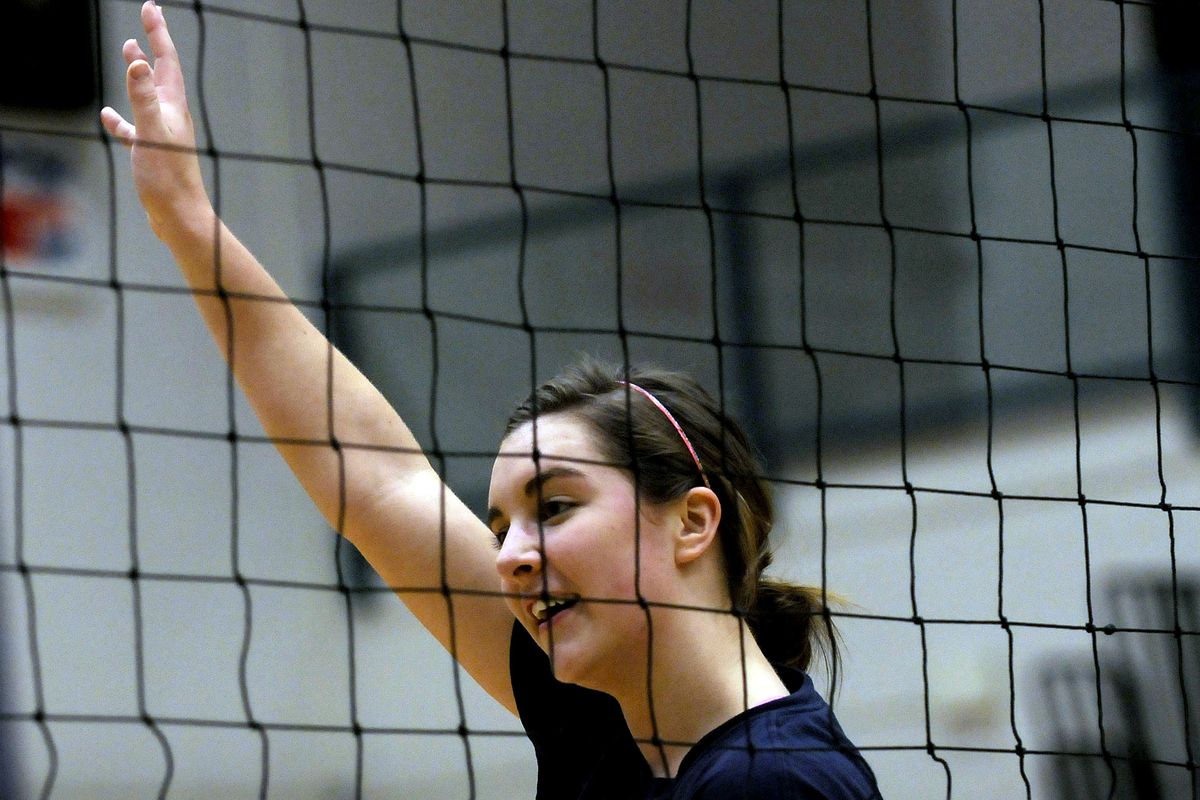 Hilary Ayers signals during practice at Lake City High School. Ayers, a senior, has switched to the team setter position under new coach Bret Taylor. She was an outside hitter the past two years. (Kathy Plonka / The Spokesman-Review)
