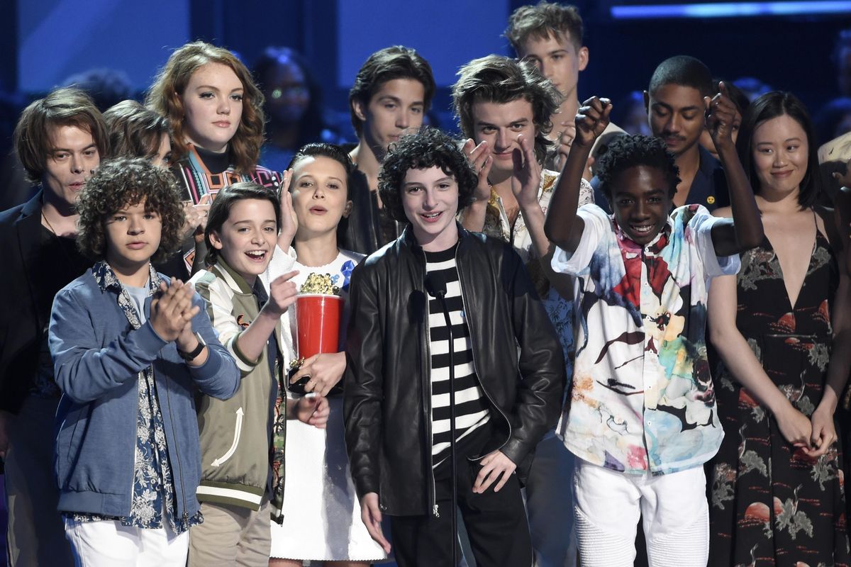 The cast of "Stranger Things" accepts the award for show of the year at the MTV Movie and TV Awards at the Shrine Auditorium on Sunday, May 7, 2017, in Los Angeles. (Chris Pizzello / Invision/AP)